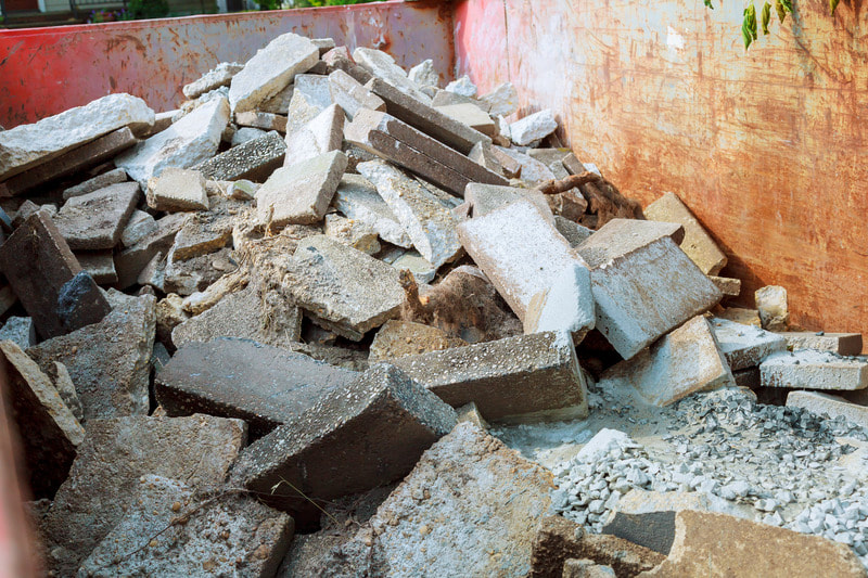Concrete blocks stacked up in one of our dumpsters