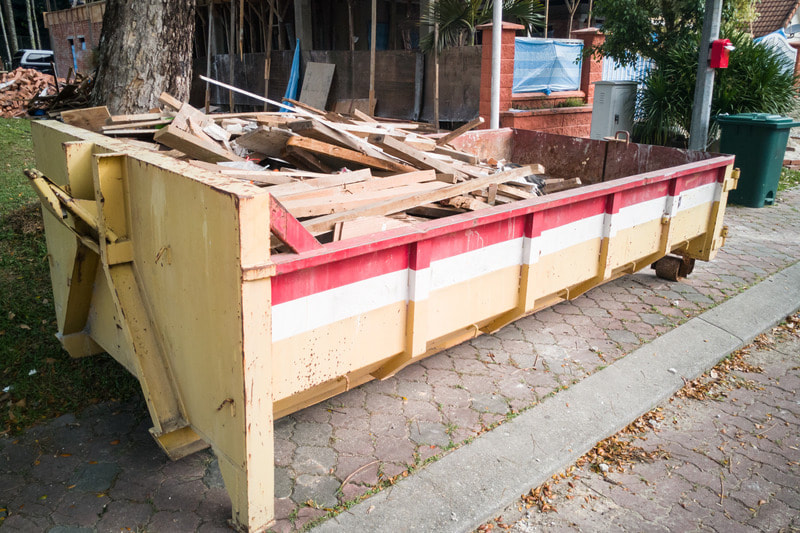 Scrap wood is placed in one of our dumpsters.